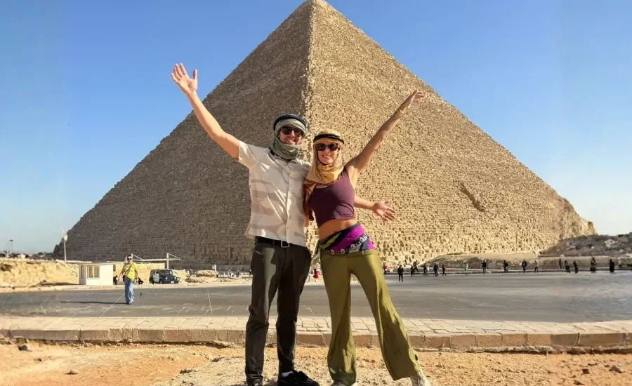 Travelers posing in front of the Great Pyramid of Giza during a 5 Days Cairo and Alexandria Tour Package