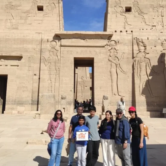 Travelers visiting Philae Temple during the 5 Days Cairo, Luxor and Alexandria Tour Package