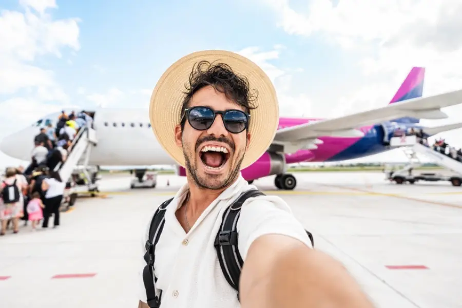 A traveler taking photo with travelers on the plane - Egypt Travel Cost 2026: How Much Does a Trip to Egypt Really Cost? - Egypt Tours Group