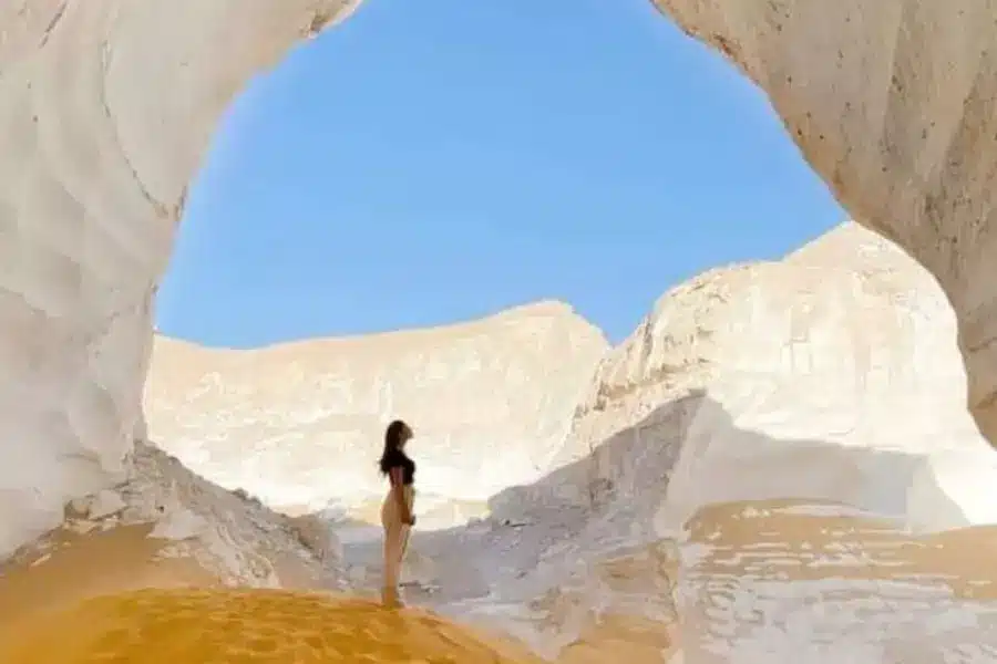 A tourist enjoying the atmosphere at the White Desert - Bahariya Oasis, Egypt: the Complete Travel Guide to the Western Desert - Egypt Tours Group