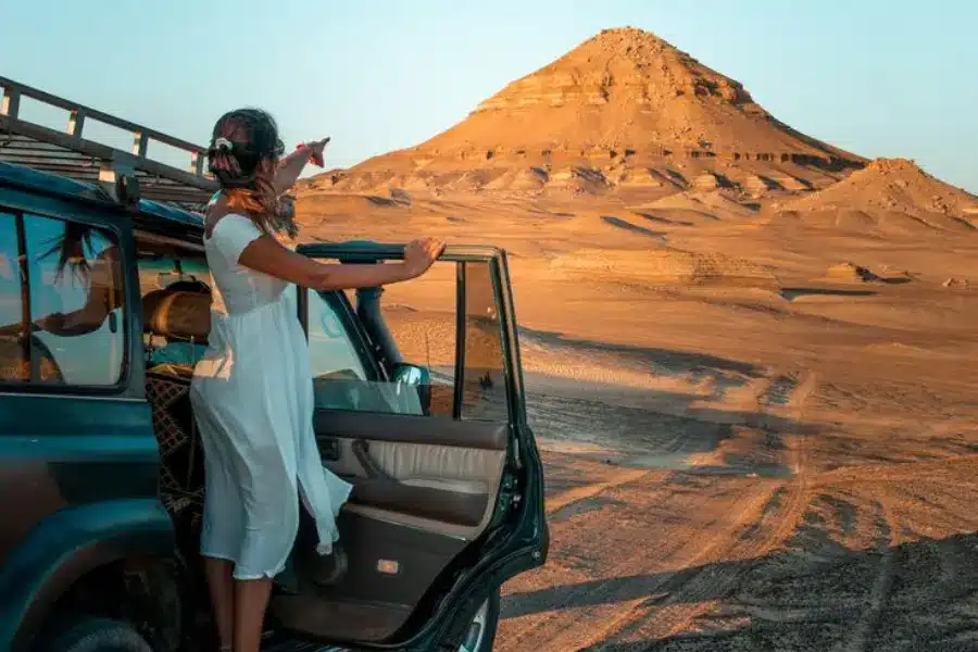 A tourist discovering the Black Desert in Egypt - Bahariya Oasis, Egypt: the Complete Travel Guide to the Western Desert - Egypt Tours Group