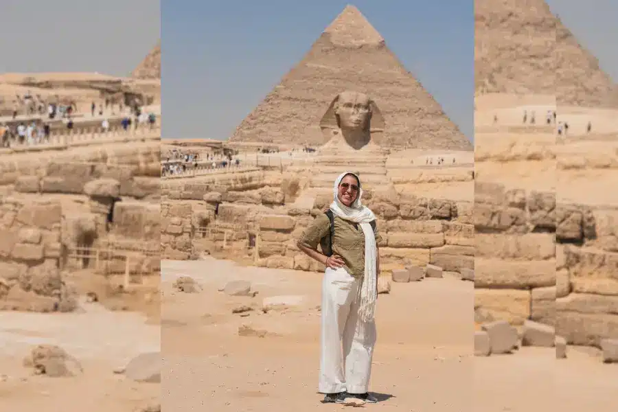 A solo female tourist at the pyramids- Solo Female Travel in Egypt: Is It Safe? What to Wear, Routes & Tips (2026) - Egypt Tours Group