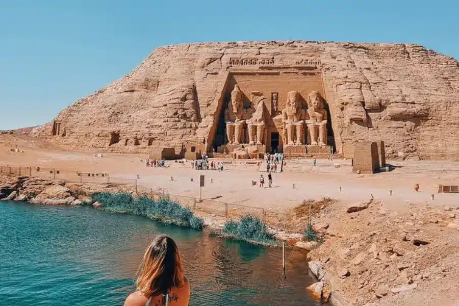 A tourist enjoys at Abu Simbel temple and lake - Egypt Travel Guide 2026: How to Plan Your First Trip, What to See & What to Expect The Ultimate Egypt Travel Guide 2026 - Egypt Tours Group