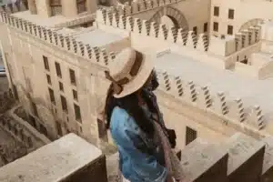 A woman enjoying the spirit of Ibn Tulon Mosque - Cairo Day Trips - Egypt Tours Group