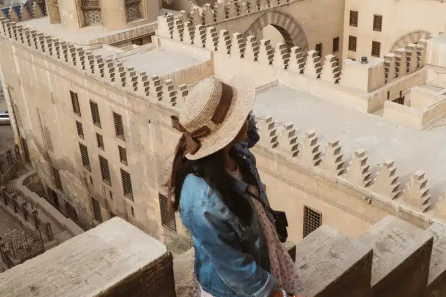 A woman enjoying the spirit of Ibn Tulon Mosque - Cairo Day Trips - Egypt Tours Group