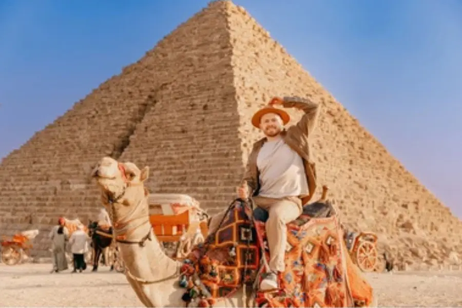 A man enjoying camel ride at the Pyramids - Cairo Day Trips - Egypt Tours Group