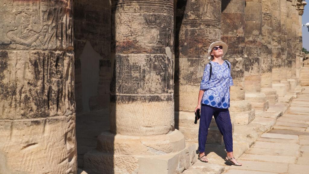 Walking through the columns of Philae Temple in Aswan during Egypt 6 Days Tour
