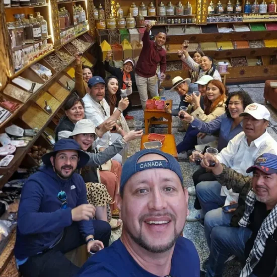 Tour group enjoying a spice shop visit in Cairo during a 4 Days Cairo & Abu Simbel Tour Package