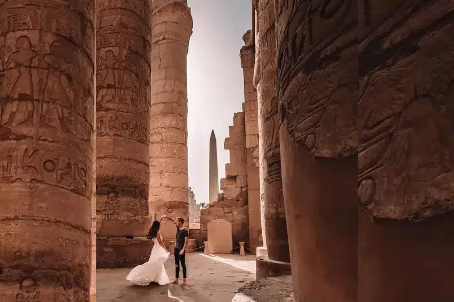 A couple dancing at Karnak temple - Egypt Honeymoon Guide: Romantic Itineraries, Best Hotels & What to Expect - Egypt Tours Group