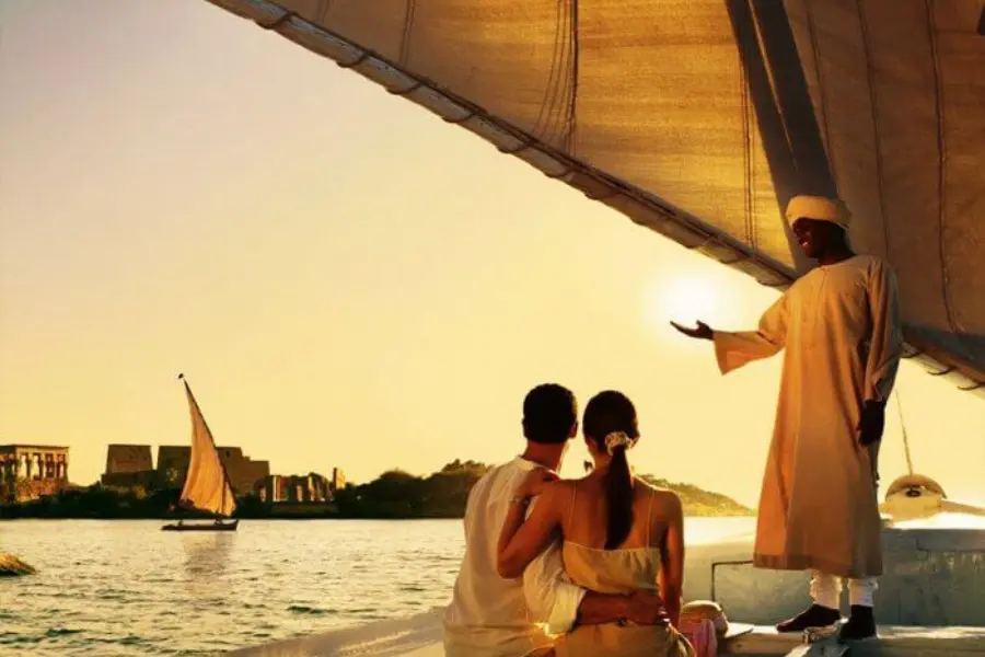 A couple enjoy the Nile view on a Nile Cruise- Egypt Honeymoon Guide: Romantic Itineraries, Best Hotels & What to Expect - Egypt Tours Group