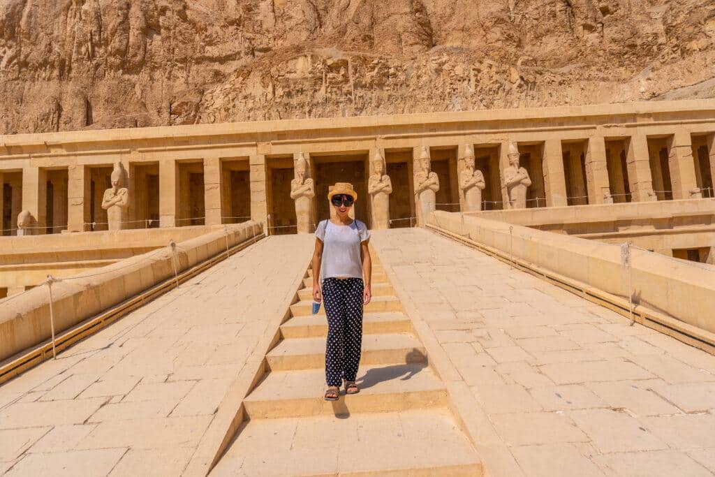 A tourist at the mortuary temple of Hatshepsut in Luxor as a part of our 6 Days Cairo, Luxor and Aswan Tour Package