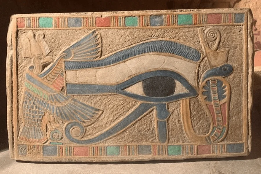 Ancient Egyptian hieroglyphs depicting the Eye of Horus with Egypt Tours Group