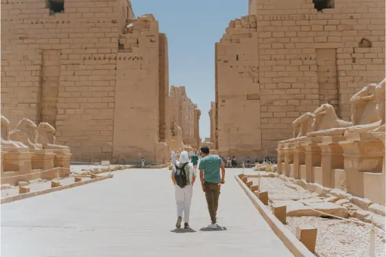 Ancient Egyptian Temples – Luxor Temple Front View Solo traveler in front of Luxor Temple exploring Ancient Egyptian temples