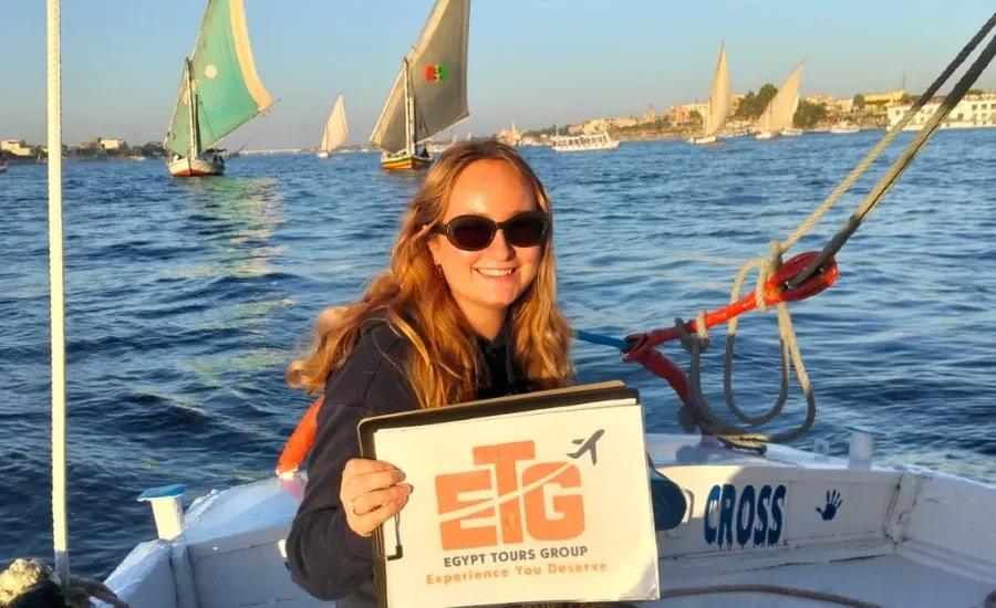 Traveler enjoying a Nile felucca experience during 10 Days Cairo, Nile Cruise & Hurghada Tour with Egypt Tours Group