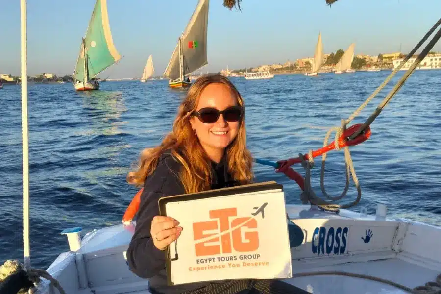 Traveler enjoying a Nile felucca experience during 10 Days Cairo, Nile Cruise & Hurghada Tour with Egypt Tours Group