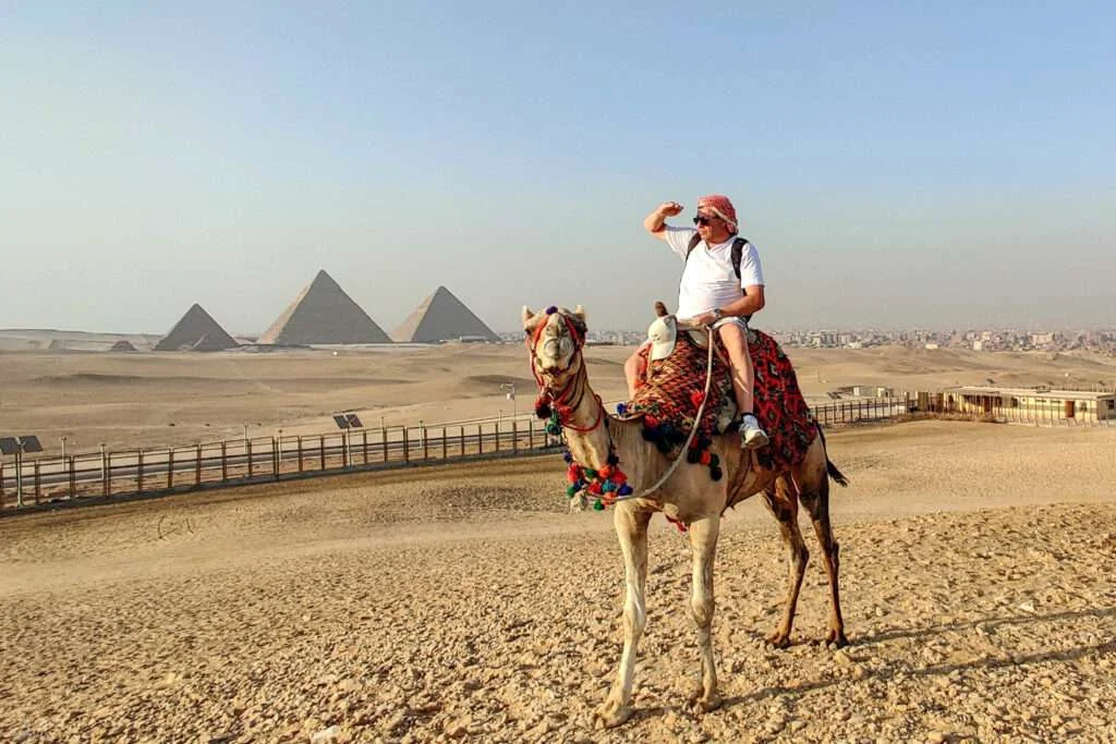 Camel ride at Giza Pyramids in Cairo Egypt