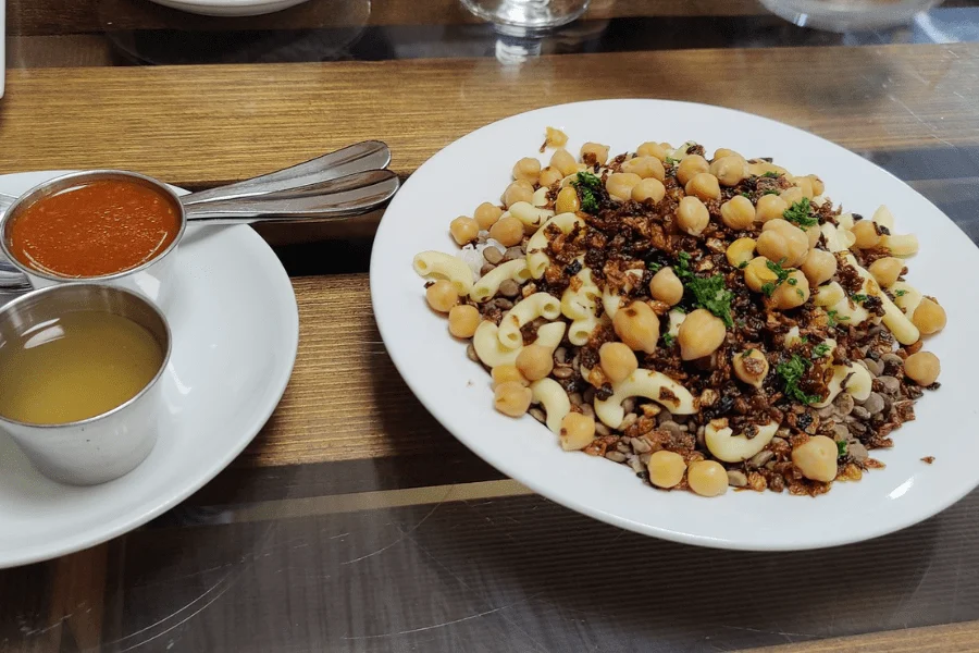 Koshari Egyptian street food with lentils rice and fried onions