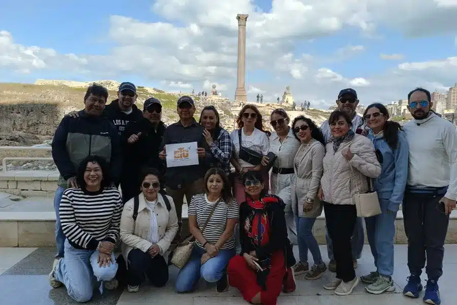 Travelers visiting Pompey's Pillar in Alexandria during 9 Days Cairo, Alexandria & Sharm El Sheikh Holiday with Egypt Tours Group