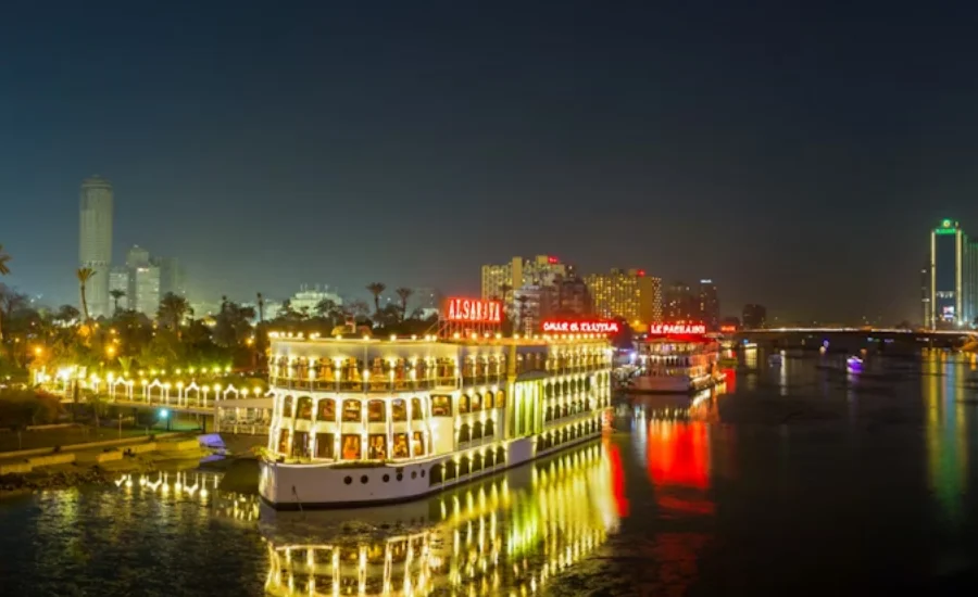 Nile River Dinner Cruise with Cairo skyline in the background - 12 Days Cairo, Nile Cruise, Hurghada & Bahariya Oasis Tour