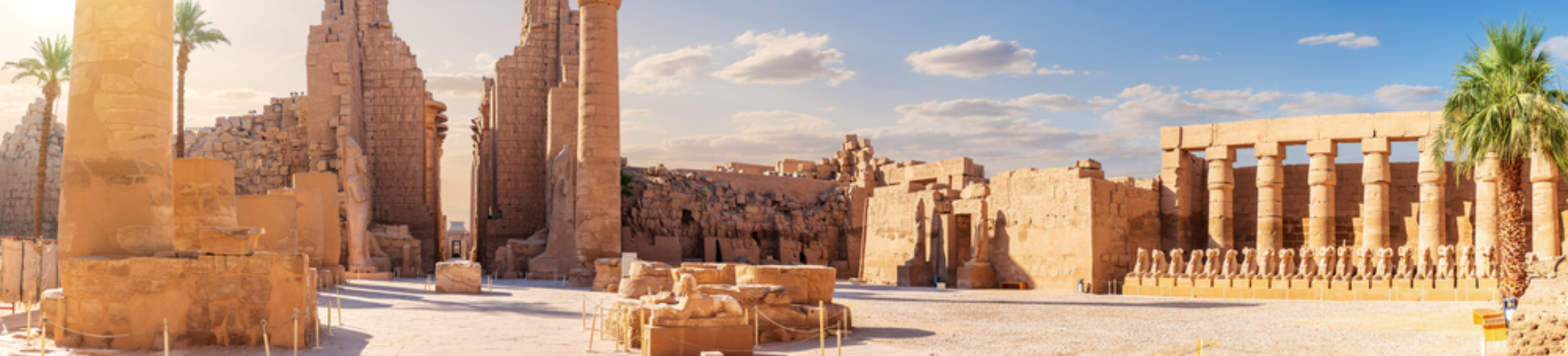 2 Days Trip to Luxor from El Gouna - Tourists exploring the colossal columns of Karnak Temple on a Luxor trip.