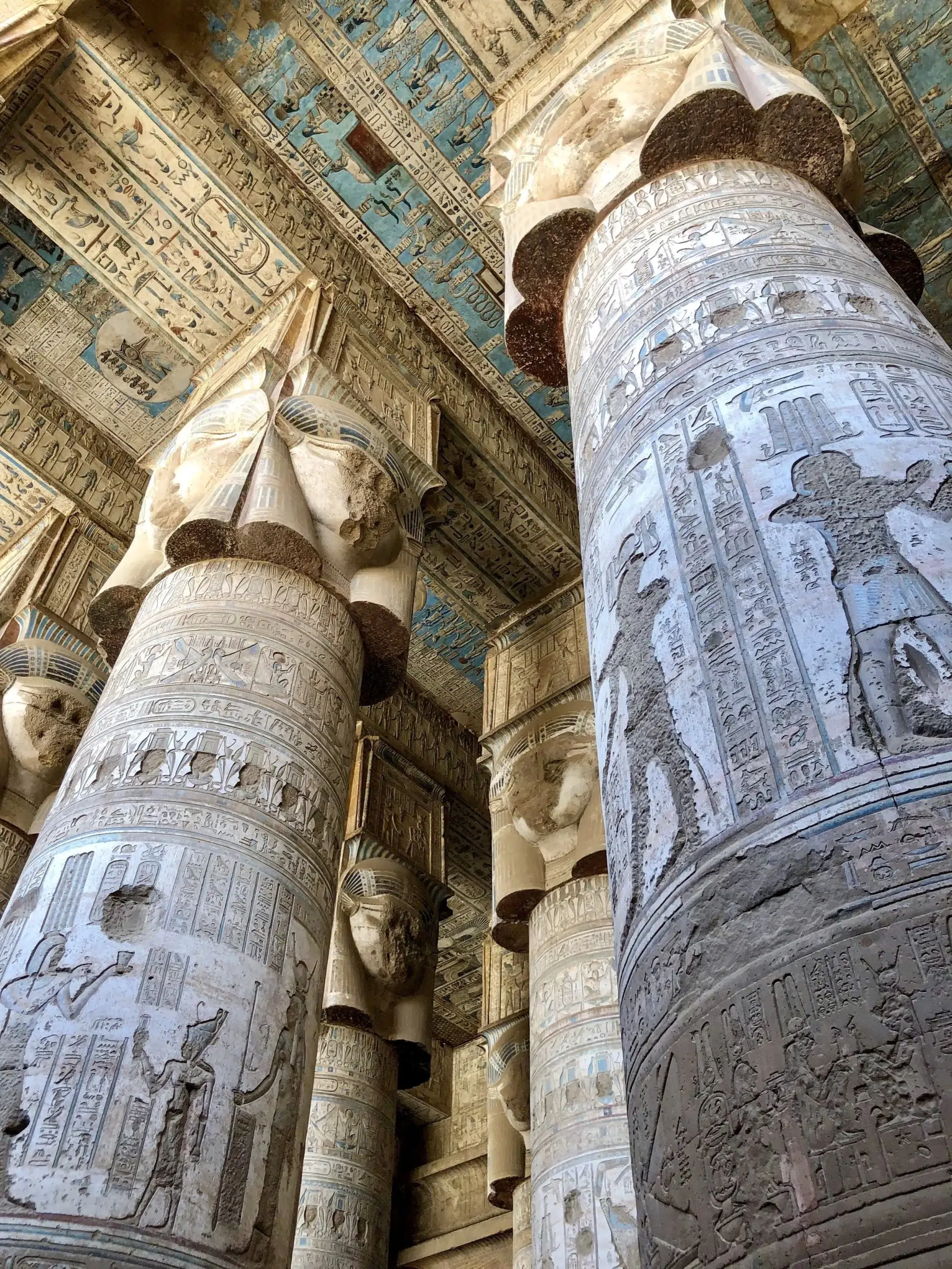 Dendera Temple Egypt interior with painted ceiling and Hathor columns