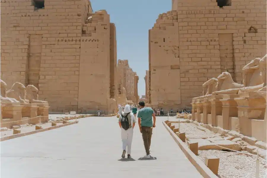 Visitors walking through Karnak Temple in Luxor, Egypt