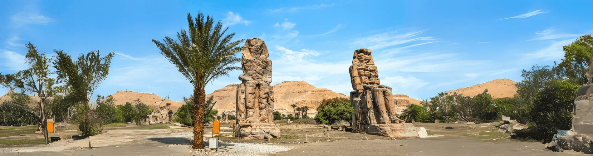 The Colossi of Memnon stand tall as timeless guardians of ancient Thebes, part of our 2-Day Luxor and Abu Simbel Tour from Cairo