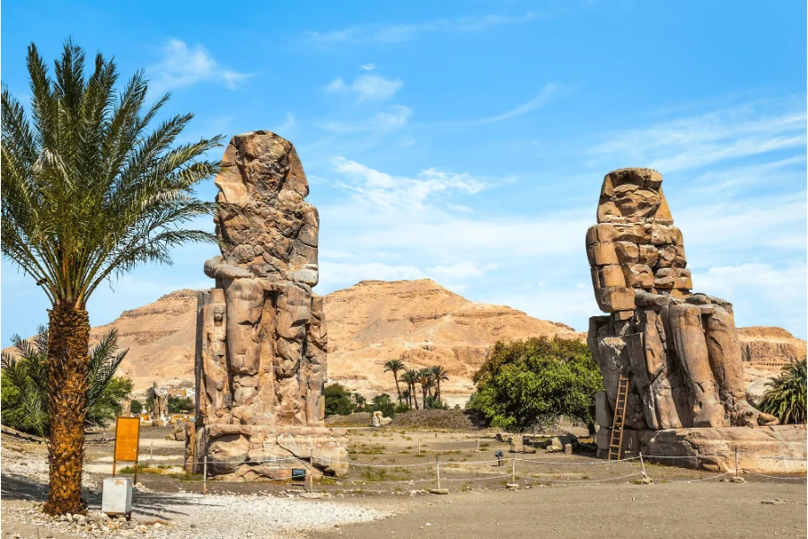 The Colossi of Memnon stand tall as timeless guardians of ancient Thebes.