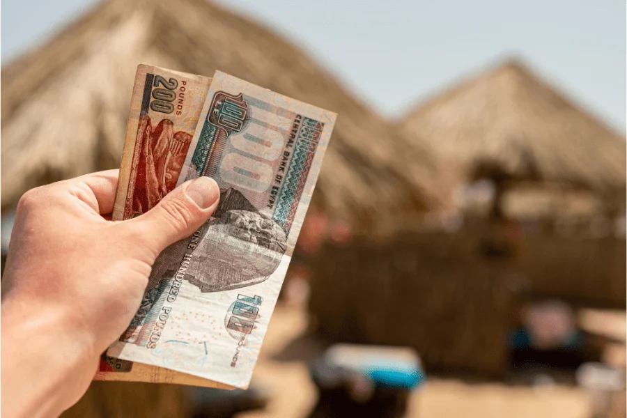 Egyptian pounds and ATM in a local market