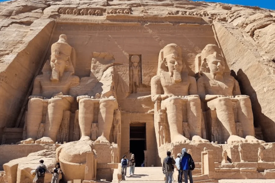 Colossal statues at the entrance of Abu Simbel Temple, Egypt - 7 Days Cairo, Luxor, Aswan & Abu Simbel – Egypt Easter Tour.