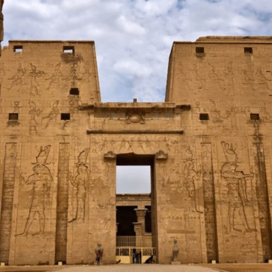 Entrance to Edfu Temple guarded by falcon statues - 4 Days Easter Nile Cruise Tour in Egypt