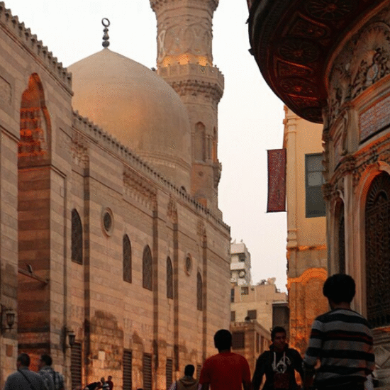 Historical architecture along El Moez Street at night