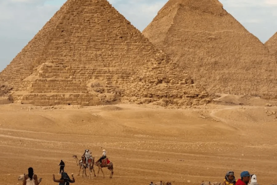 The three pyramids of Giza with the desert and sky in the background, Egypt.