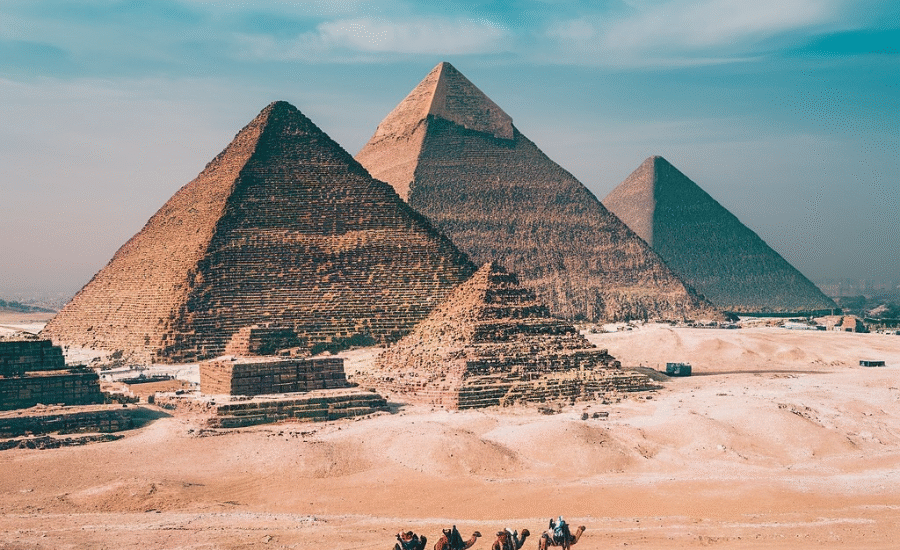 Giza pyramids with the Sphinx under blue sky