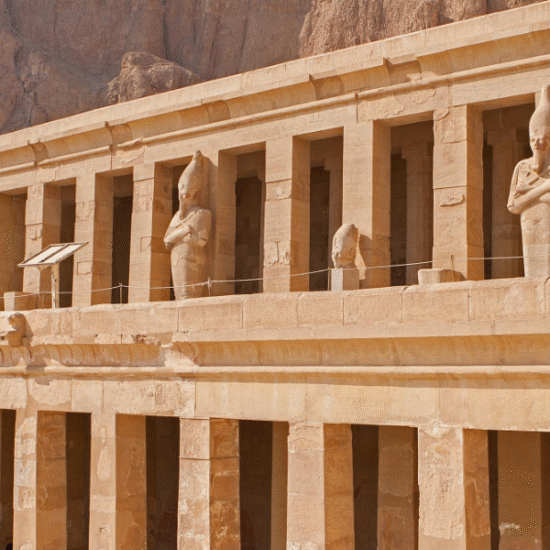 Terraced structure of Hatshepsut Temple nestled against cliffs in Luxor, Egypt - 10 Days Cairo, Hurghada & Nile Cruise Easter Holiday Tour.