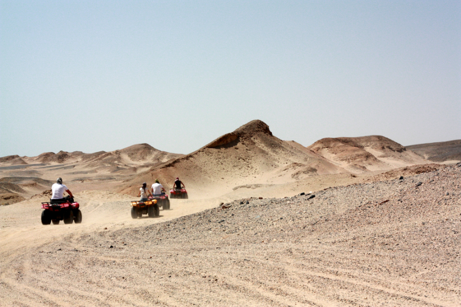 Traveler driving a beach buggy on a desert safari in Marsa Alam