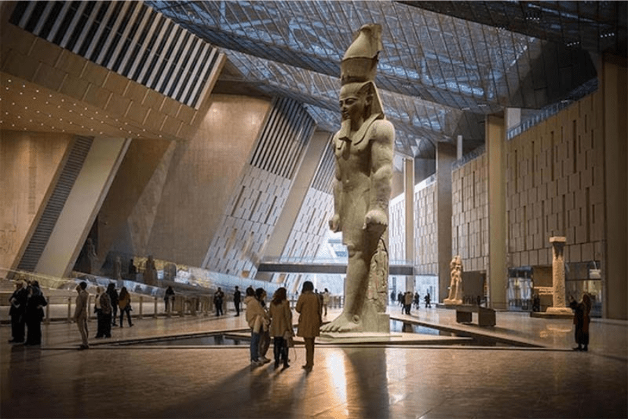 Tourists exploring the interior of the Grand Egyptian Museum