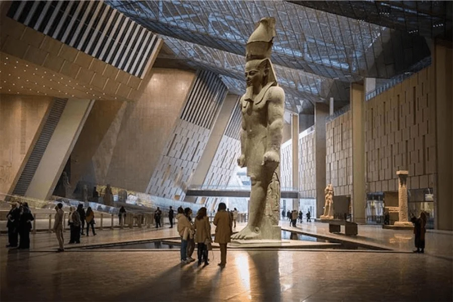 Tourists exploring the interior of the Grand Egyptian Museum
