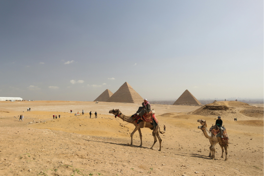 Tourist visiting Giza Pyramids on a day trip from Hurghada