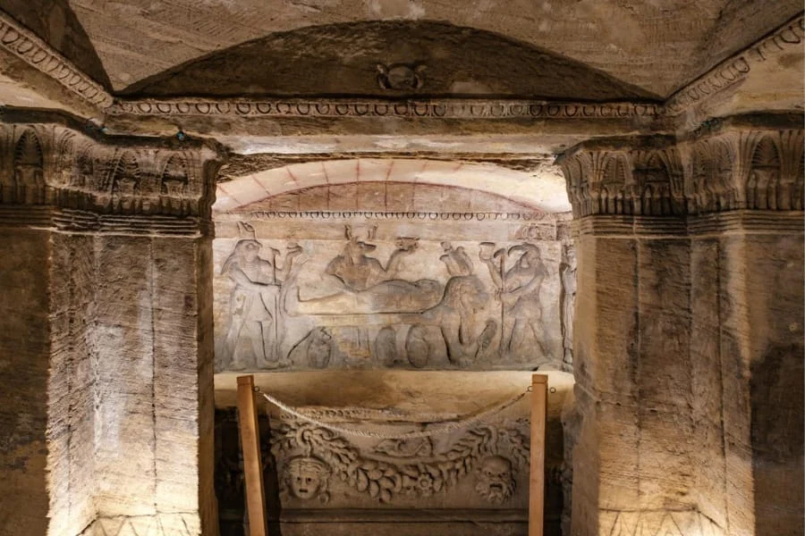 the historical carvings inside the catacombs of Kom El Shoqafa