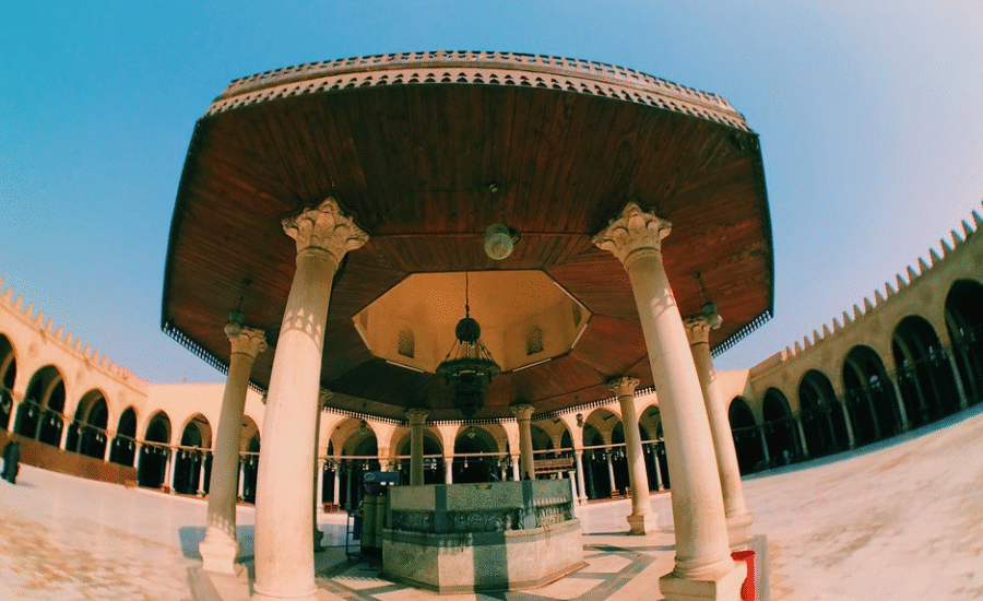 Morning sunlight shining through the arches of Amr Ibn Al-As Mosque in Old Cairo