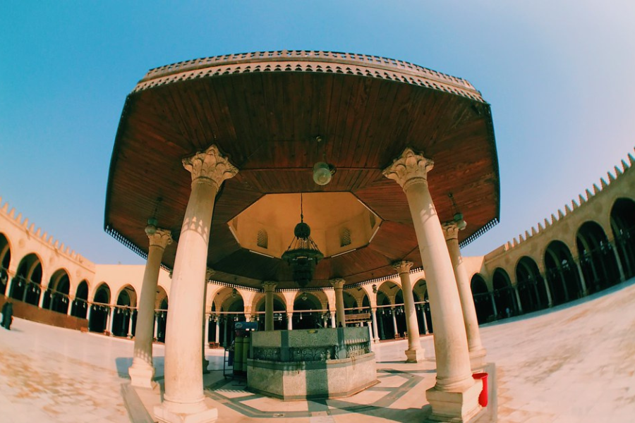 Morning sunlight shining through the arches of Amr Ibn Al-As Mosque in Old Cairo
