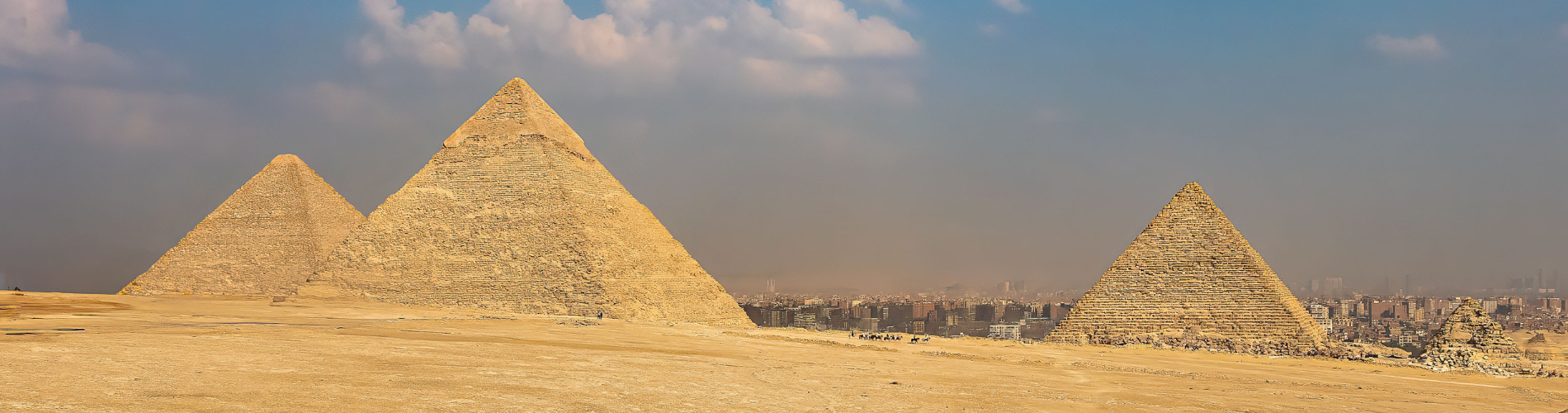 Morning view of the Great Pyramids of Giza with golden sunlight over the desert during our 7 Days Egypt Family Tour – Cairo, Luxor & Aswan Package