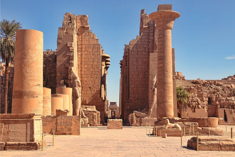 Morning sunlight illuminating the grand columns and sacred halls of Karnak Temple in Luxor
