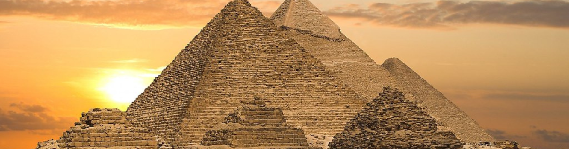 Morning view of the Great Pyramids of Giza with golden sunlight during our 4 Days Cairo Budget Tour