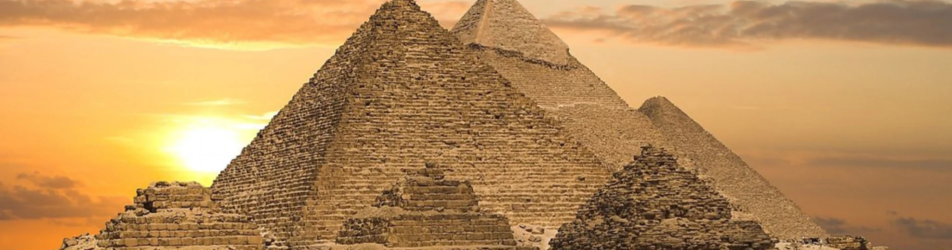Morning view of the Great Pyramids of Giza with golden sunlight during our 4 Days Cairo Budget Tour