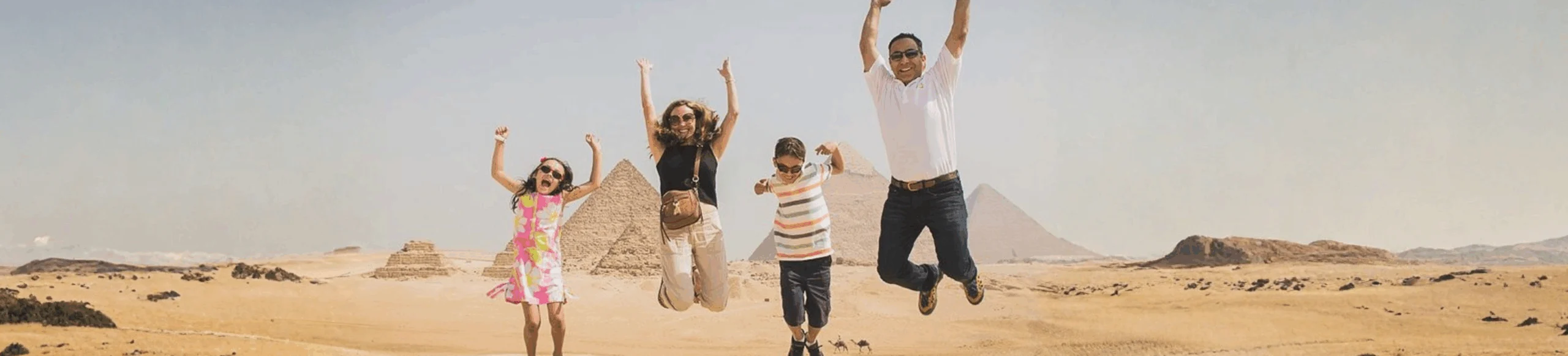 Family enjoying a fun Egypt family tours packages at the Giza Pyramids