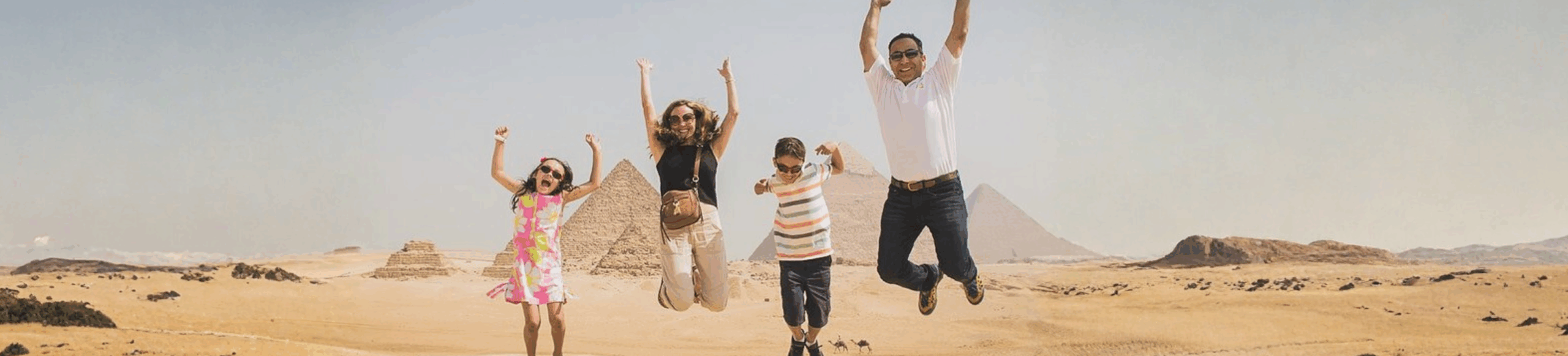 Family enjoying a fun Egypt family tour package at the Giza Pyramids