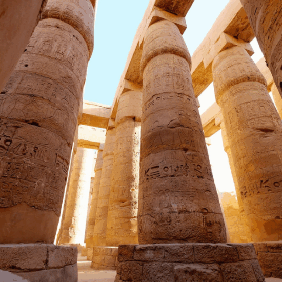 Visitors exploring the grand Karnak Temple in Luxor, Egypt.