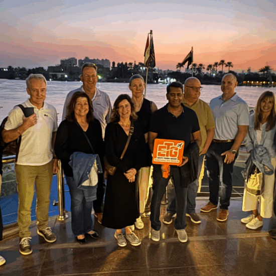 Tourists enjoying a relaxing evening on a Nile cruise after dinner.